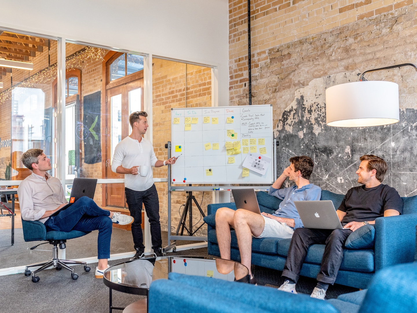 Team members sharing creative productivity ideas during meeting